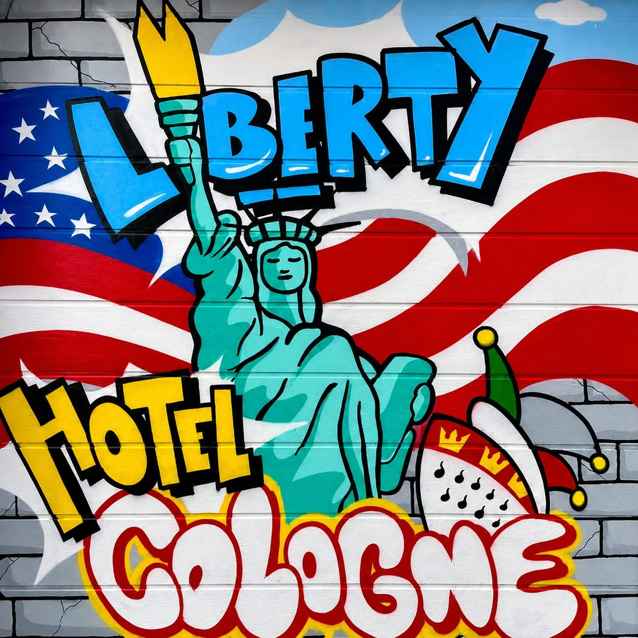 Buntes Wandbild mit Schriftzug „Liberty Hotel Cologne“
